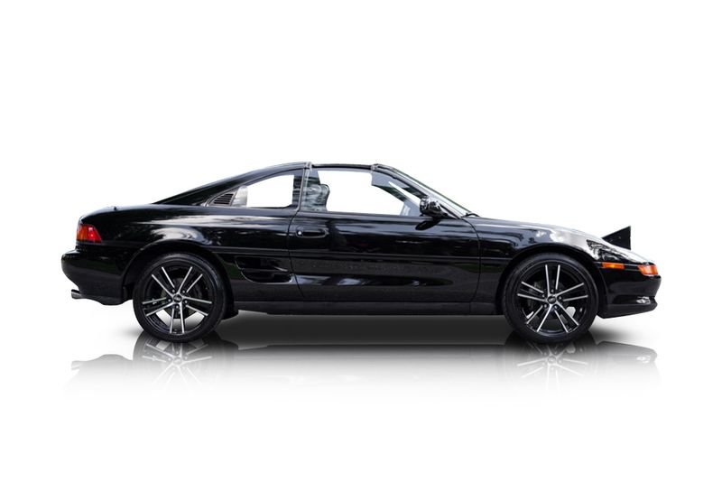 An incredible side shot photo of aToyota MR2 that you should buy.
