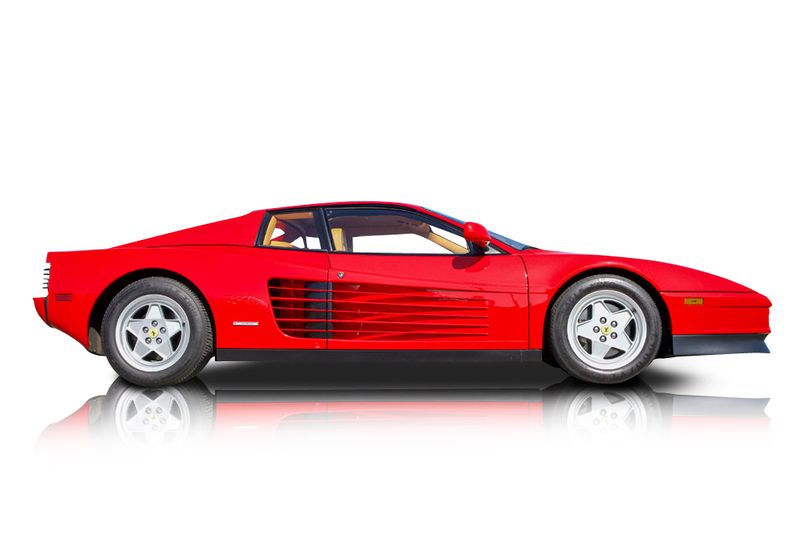 An incredible side shot photo of aFerrari Testarossa that you should buy.