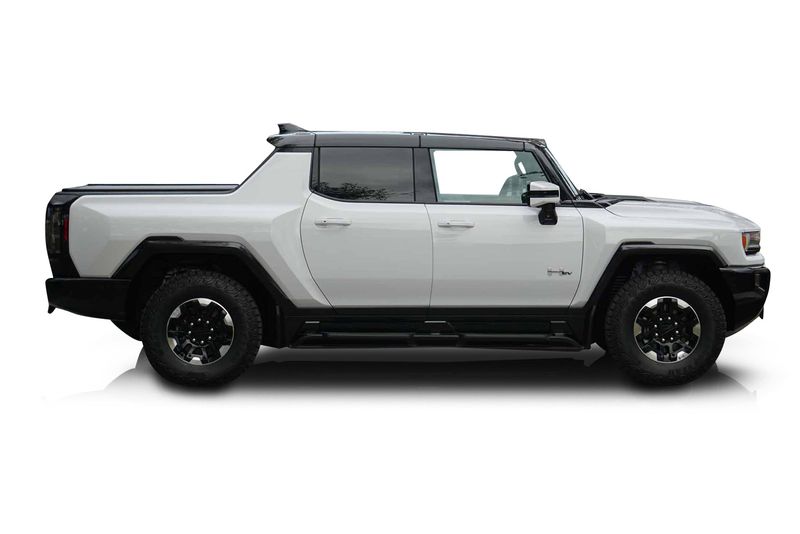 An incredible side shot photo of aGMC Hummer EV that you should buy.