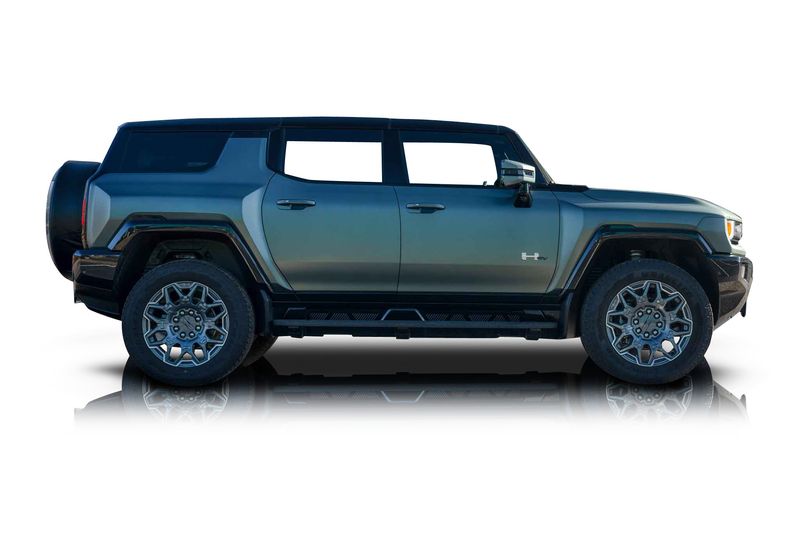 An incredible side shot photo of aGMC Hummer EV that you should buy.
