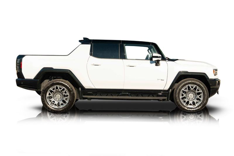 An incredible side shot photo of aGMC Hummer EV that you should buy.