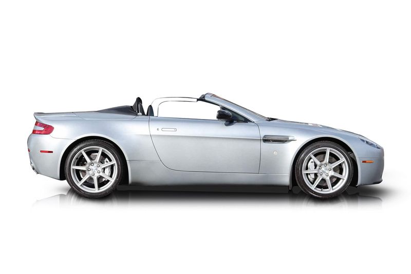 An incredible side shot photo of aAston Martin Vantage that you should buy.