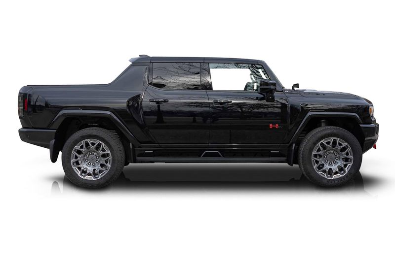 An incredible side shot photo of aGMC Hummer EV that you should buy.