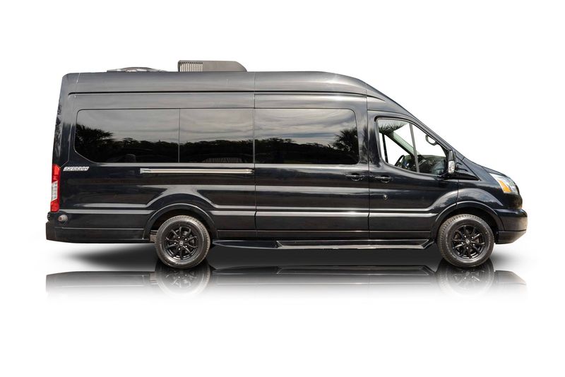An incredible side shot photo of aFord Transit that you should buy.