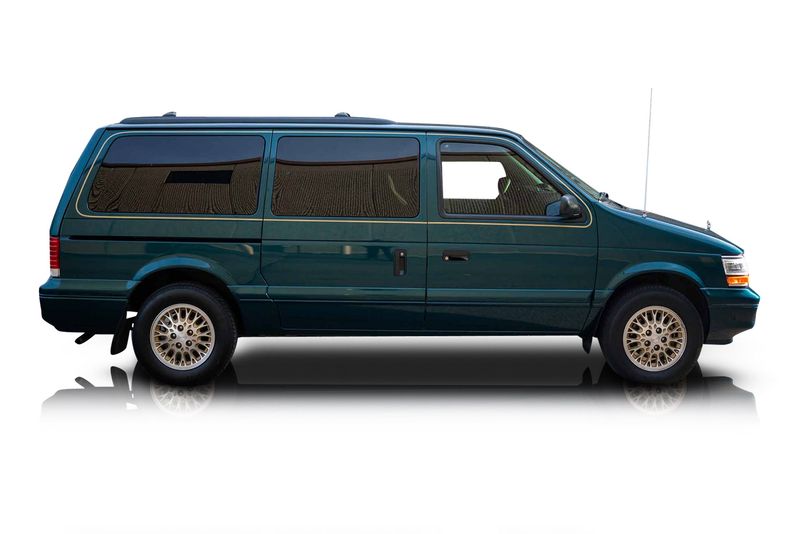 An incredible side shot photo of aPlymouth Grand Voyager that you should buy.