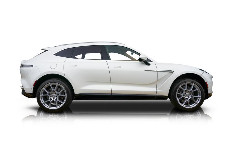 An incredible side shot photo of aAston Martin DBX that you should buy.