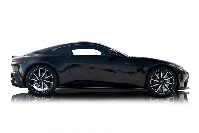 An incredible side shot photo of aAston Martin Vantage that you should buy.