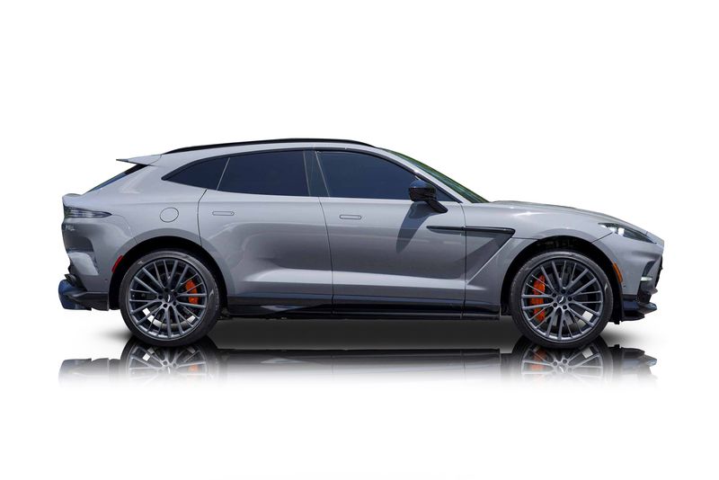 An incredible side shot photo of aAston Martin DBX that you should buy.