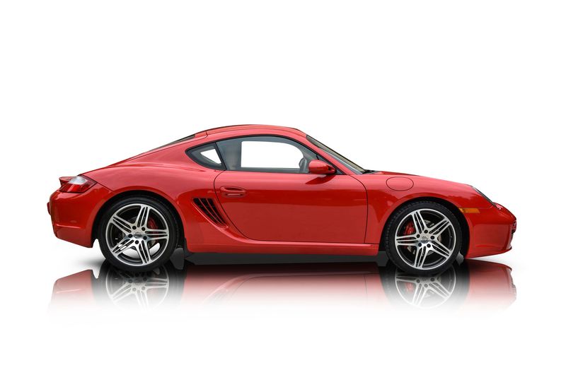 An incredible side shot photo of aPorsche Cayman that you should buy.