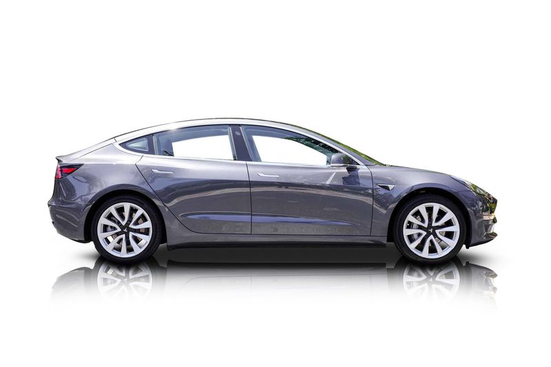 An incredible side shot photo of aTesla Model 3 that you should buy.