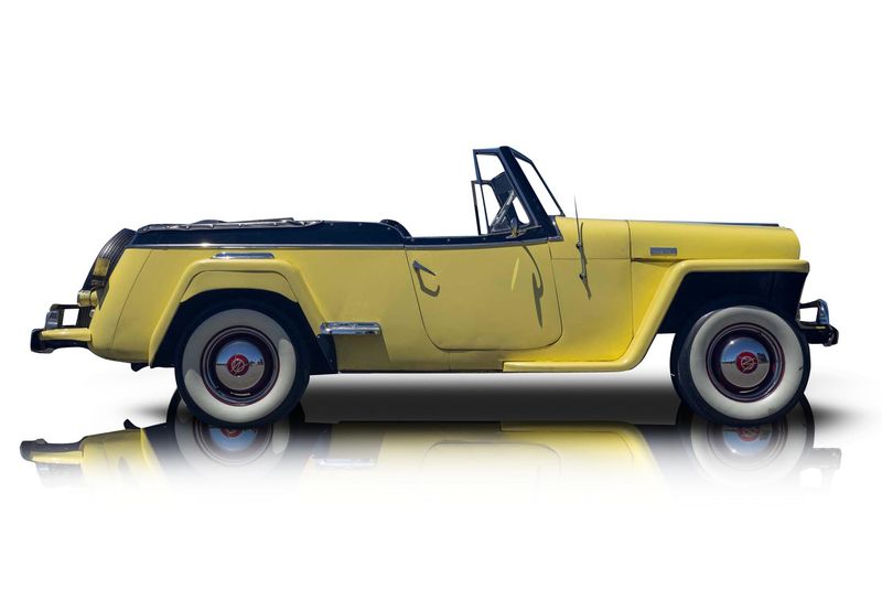 An incredible side shot photo of aWillys Jeepster that you should buy.