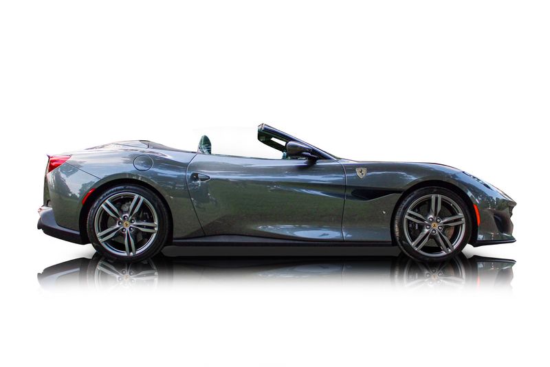An incredible side shot photo of aFerrari Portofino that you should buy.