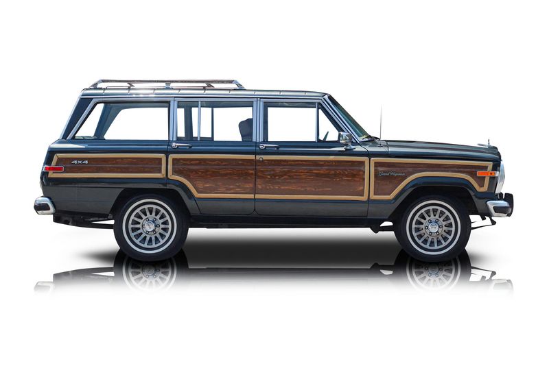 An incredible side shot photo of aJeep Grand Wagoneer that you should buy.