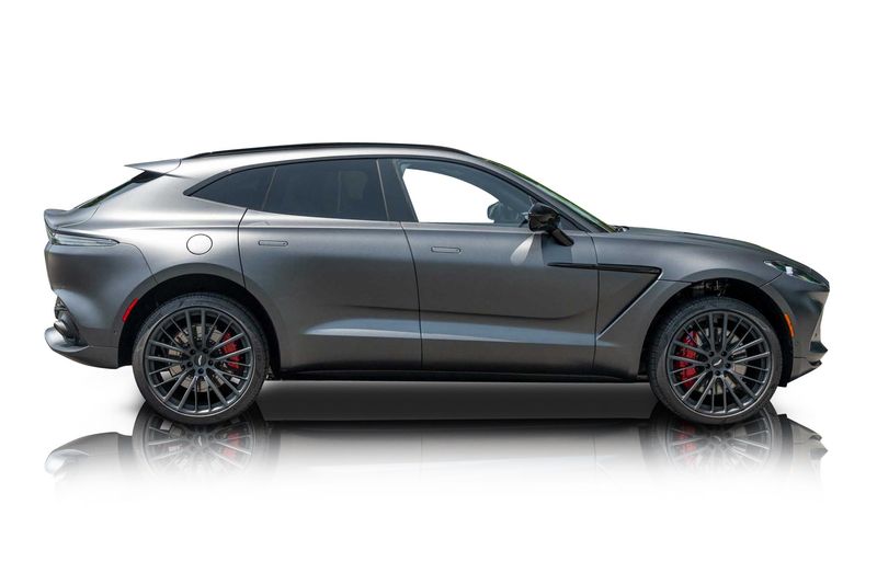 An incredible side shot photo of aAston Martin DBX that you should buy.
