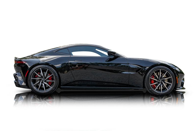 An incredible side shot photo of aAston Martin Vantage that you should buy.