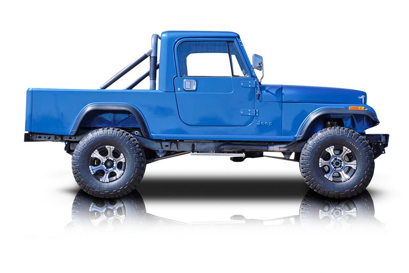 An incredible side shot photo of aJeep CJ-8 Scrambler that you should buy.