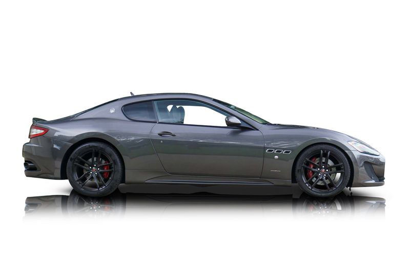An incredible side shot photo of aMaserati GranTurismo that you should buy.