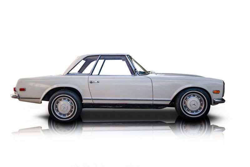 An incredible side shot photo of aMercedes-Benz 230SL that you should buy.