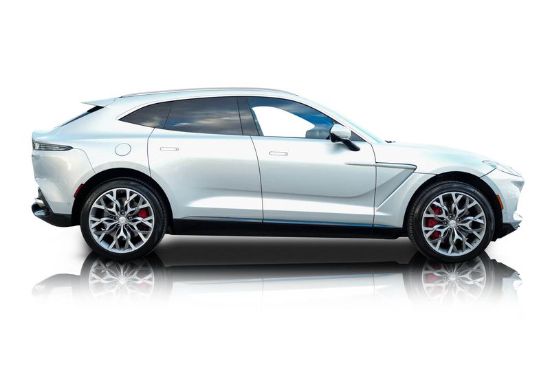 An incredible side shot photo of aAston Martin DBX that you should buy.