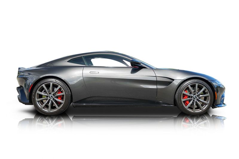 An incredible side shot photo of aAston Martin Vantage that you should buy.