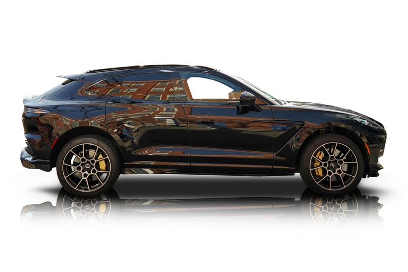 An incredible side shot photo of aAston Martin DBX that you should buy.