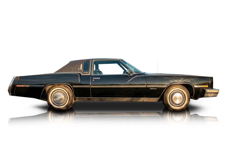 An incredible side shot photo of aOldsmobile Toronado that you should buy.