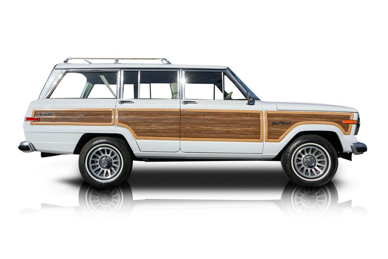 An incredible side shot photo of aJeep Grand Wagoneer that you should buy.