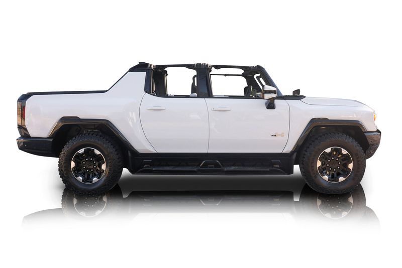 An incredible side shot photo of aGMC Hummer EV that you should buy.