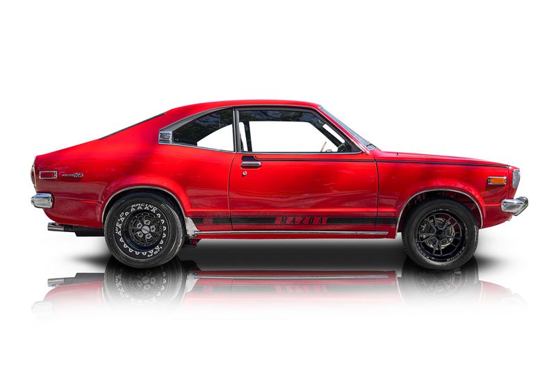 An incredible side shot photo of aMazda RX-3 that you should buy.