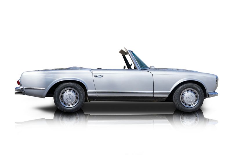 An incredible side shot photo of aMercedes-Benz 280SL that you should buy.