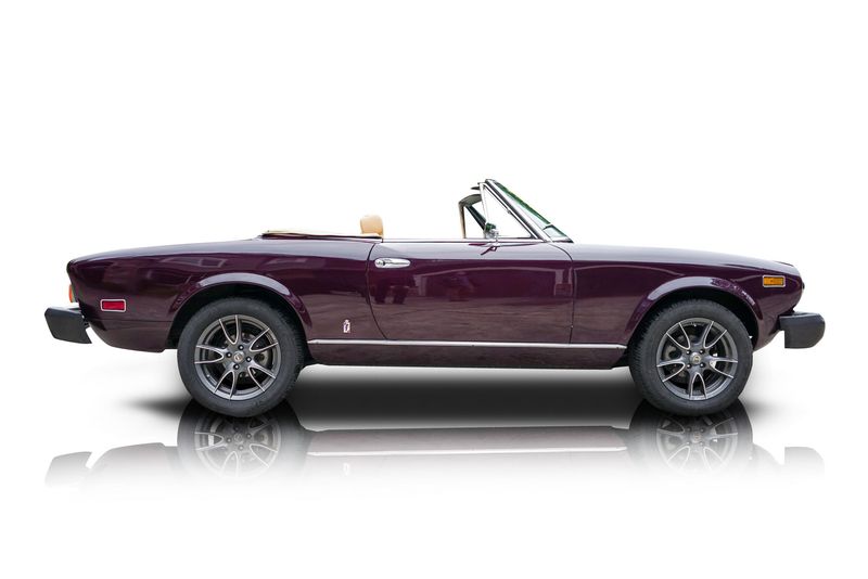 An incredible side shot photo of aFiat 124 Spider that you should buy.