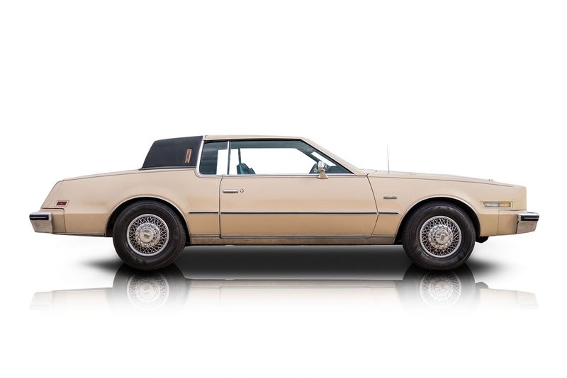 An incredible side shot photo of aOldsmobile Toronado that you should buy.