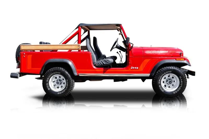 An incredible side shot photo of aJeep CJ-8 Scrambler that you should buy.