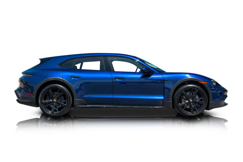 An incredible side shot photo of aPorsche Taycan that you should buy.