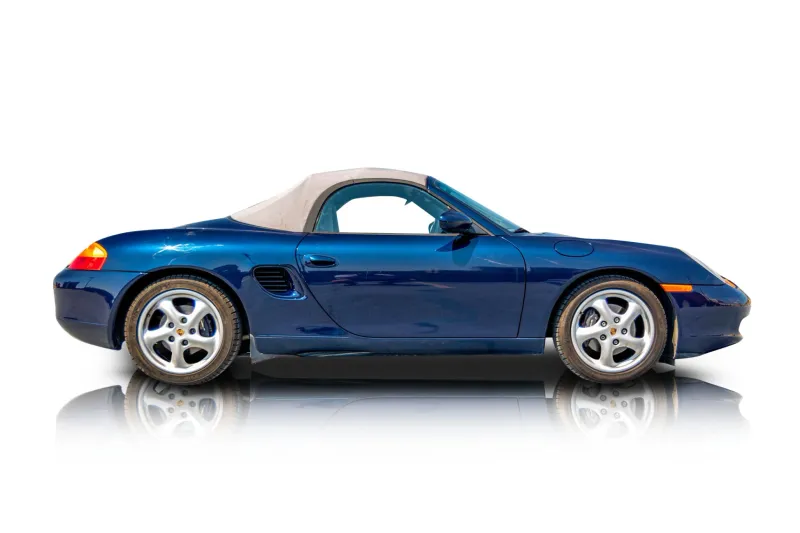 An incredible side shot photo of aPorsche Boxster that you should buy.
