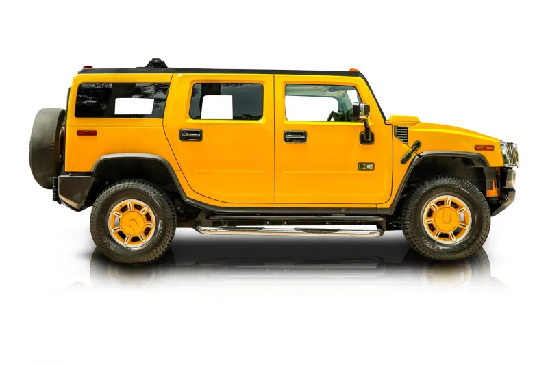 An incredible side shot photo of aHummer H2 that you should buy.