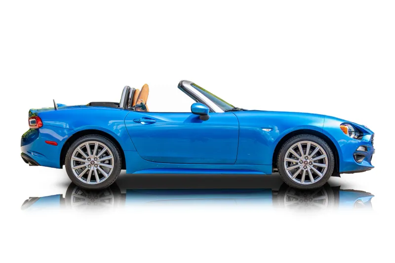An incredible side shot photo of aFiat 124 Spider that you should buy.