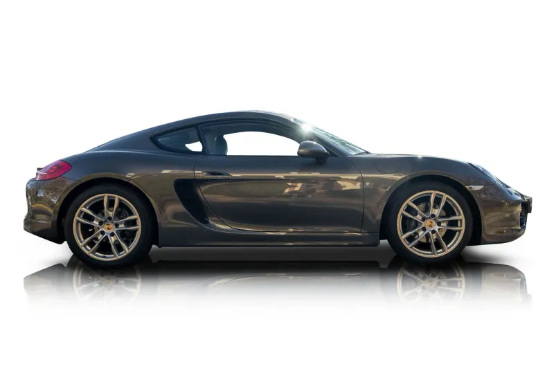 An incredible side shot photo of aPorsche Cayman that you should buy.