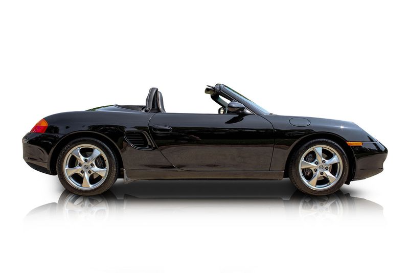 An incredible side shot photo of aPorsche Boxster that you should buy.