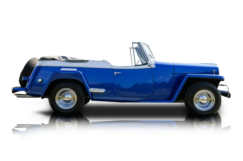 An incredible side shot photo of aWillys Jeepster that you should buy.