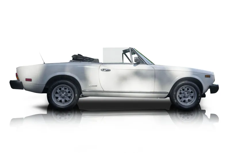 An incredible side shot photo of aFiat 124 Spider that you should buy.