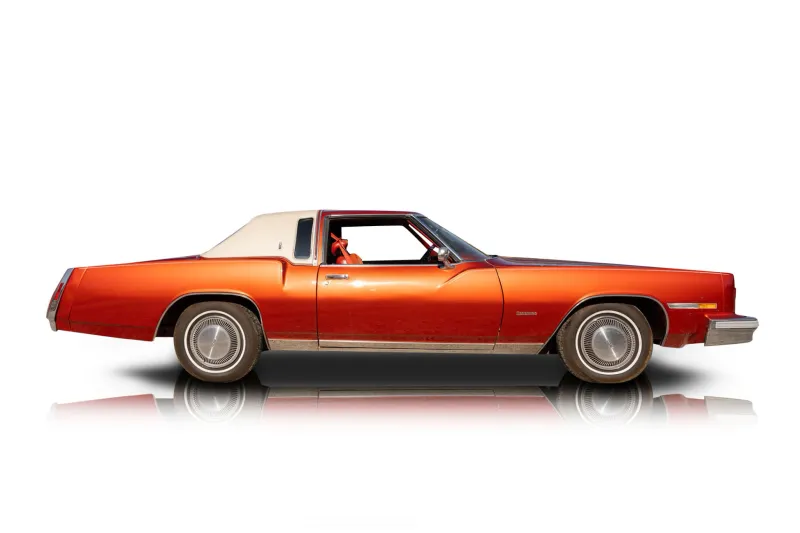 An incredible side shot photo of aOldsmobile Toronado that you should buy.