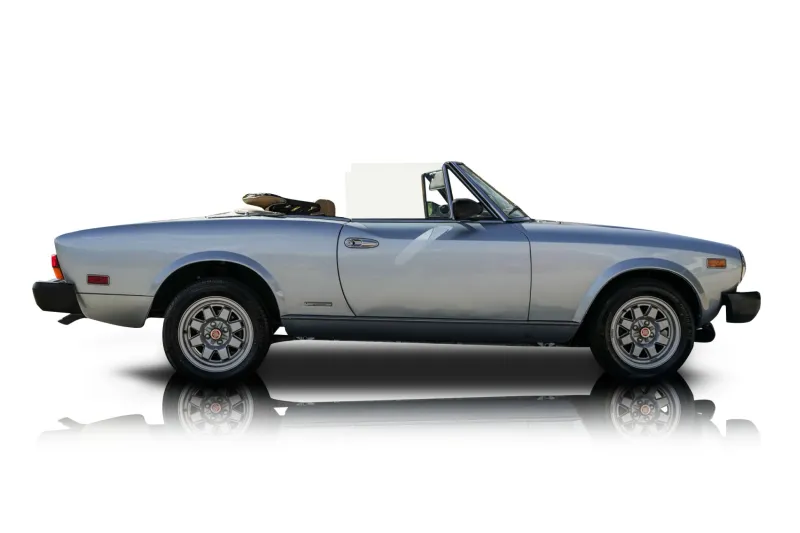 An incredible side shot photo of aFiat 124 Spider that you should buy.