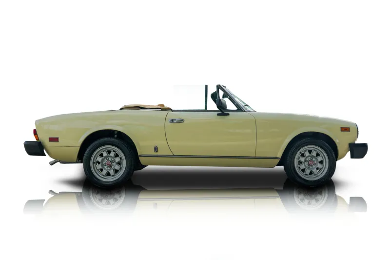 An incredible side shot photo of aFiat 124 Spider that you should buy.