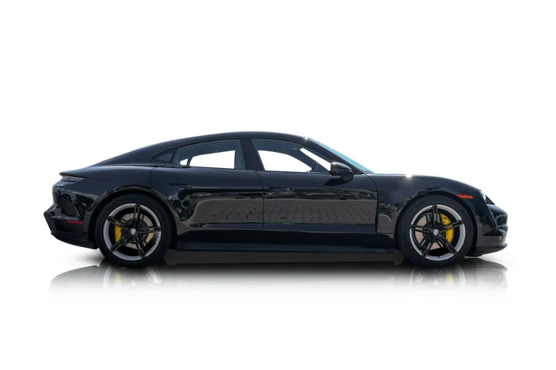An incredible side shot photo of aPorsche Taycan that you should buy.