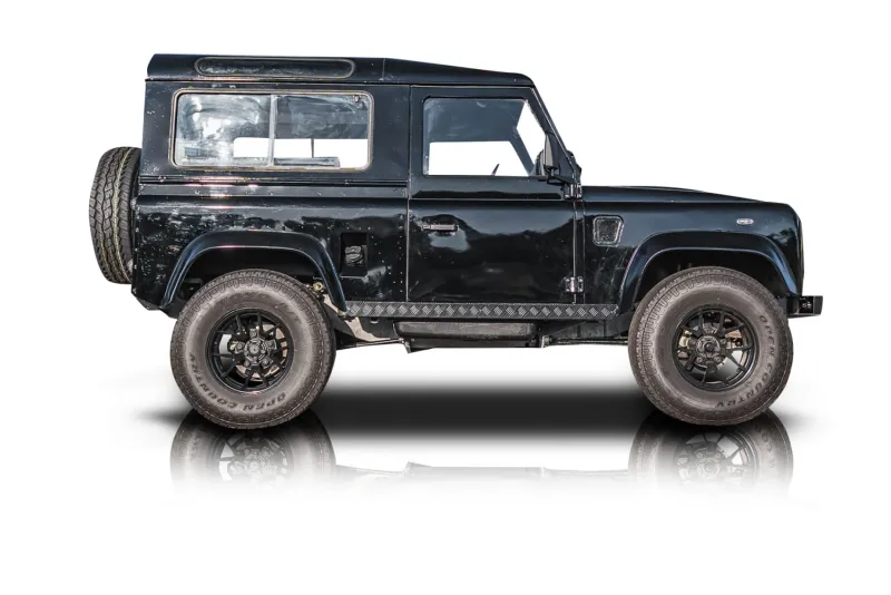 An incredible side shot photo of aLand Rover Defender 90 that you should buy.