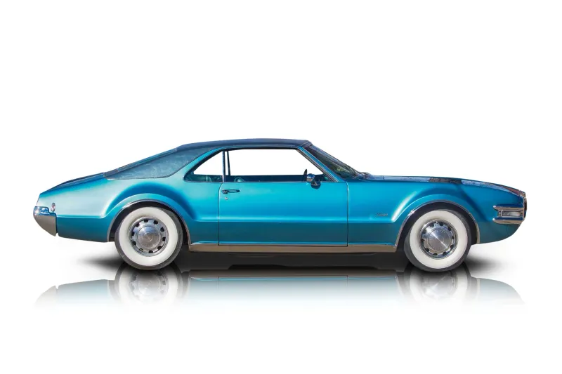 An incredible side shot photo of aOldsmobile Toronado that you should buy.