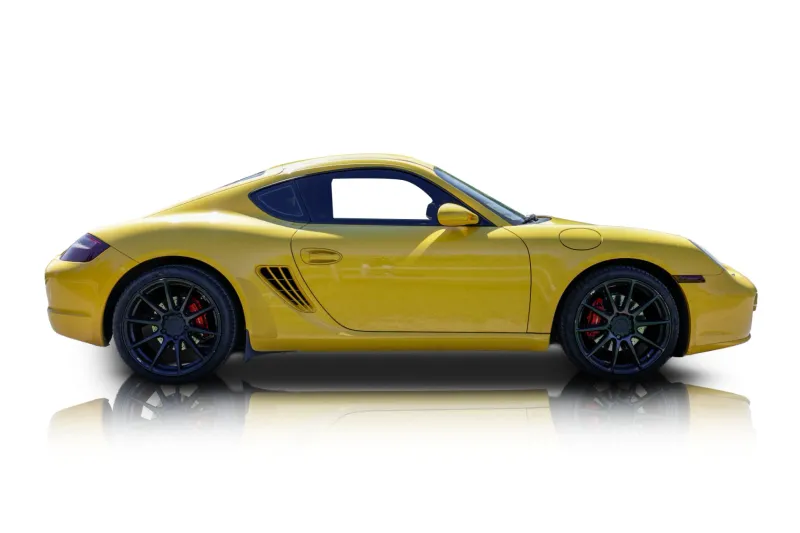 An incredible side shot photo of aPorsche Cayman that you should buy.