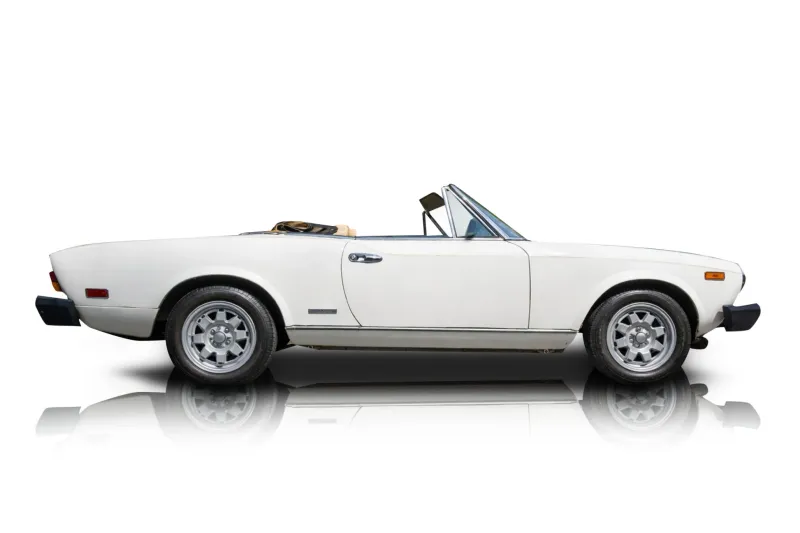 An incredible side shot photo of aFiat 124 Spider that you should buy.