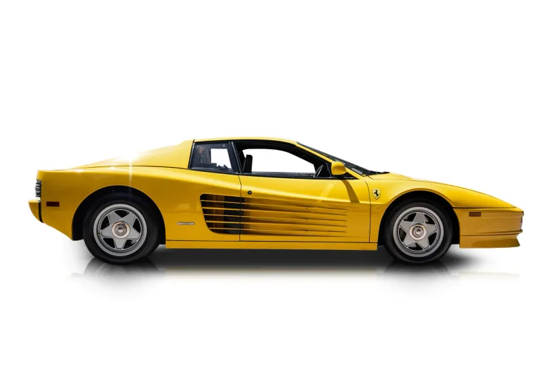An incredible side shot photo of aFerrari Testarossa that you should buy.